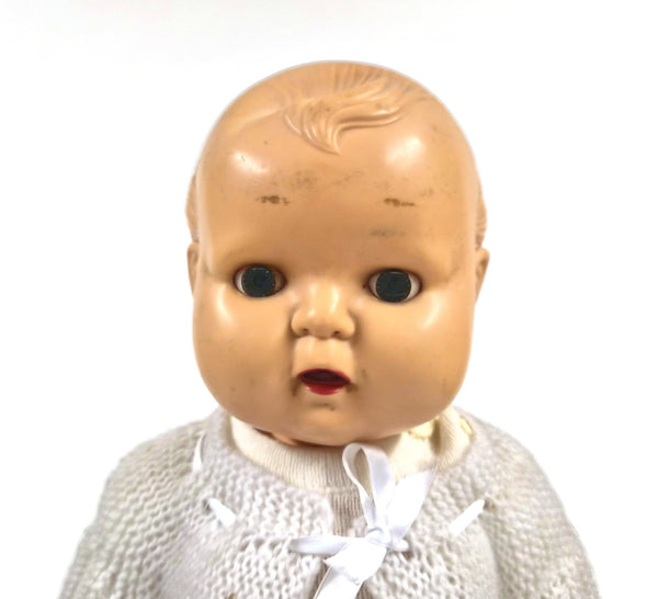 Vintage babypop van hard plastic met slaapogen en bewegende mond