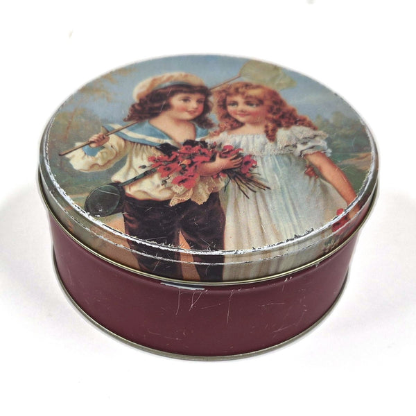 Vintage ronde blikken trommel met Victoriaanse kinderen en bloemen