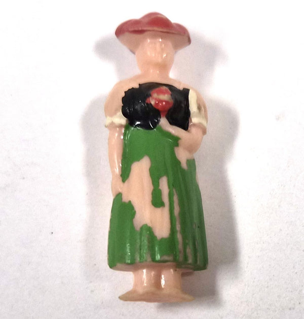 Vintage plastic figuurtje van een vrouw in klederdracht, in WHW-stijl