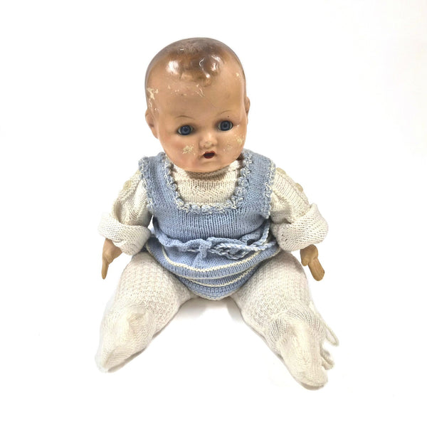 Vintage porseleinen babypop uit de jaren 30 met blauwe ogen