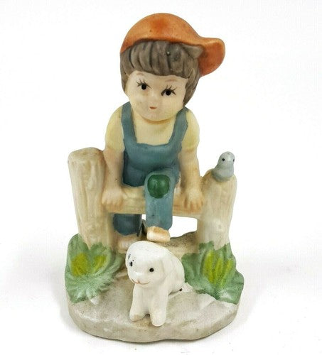 Vintage keramisch beeldje van jongen met hond, handbeschilderd